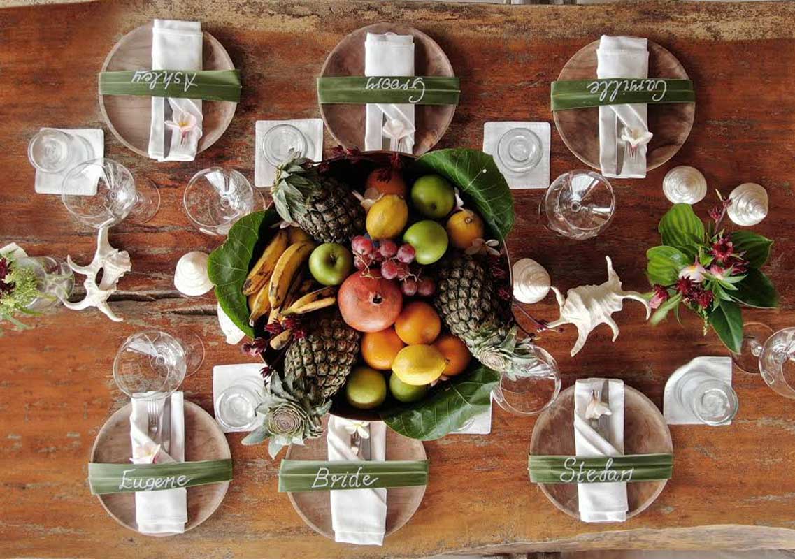 wedding-table-setup-flowers-tropical-leaves