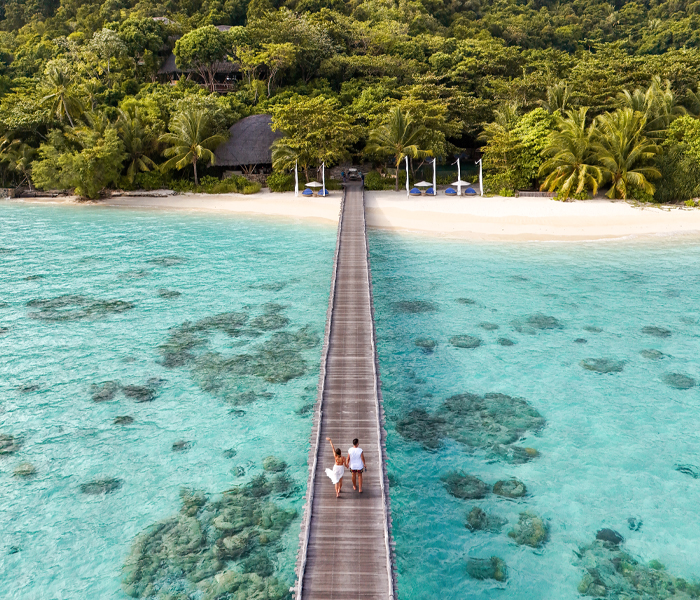 offers-jetty-aerial-couple-grouper-pool-700x600px